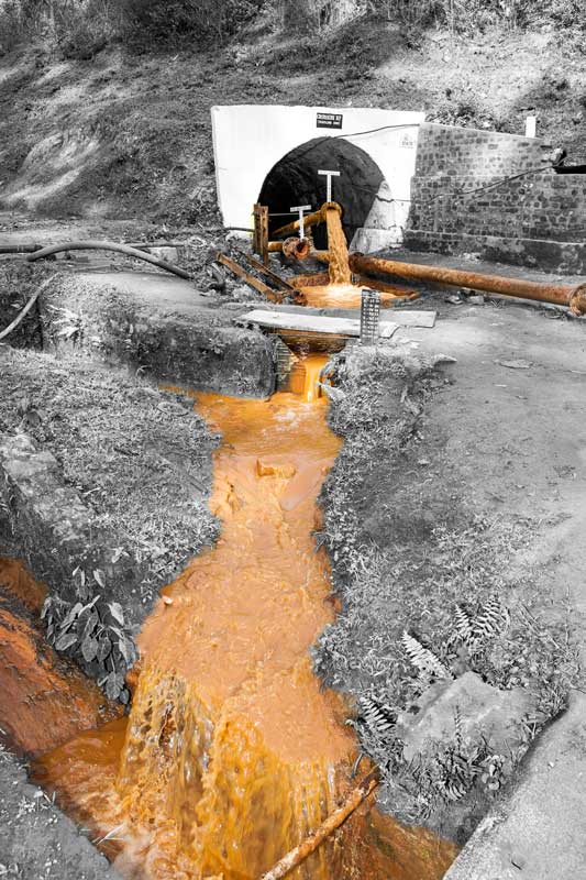 Contaminated mine water being discharged into Tipong river from Tipong Colliery of Makum Coalfield, Tinsukhia district, Assam, thus causing river pollution
